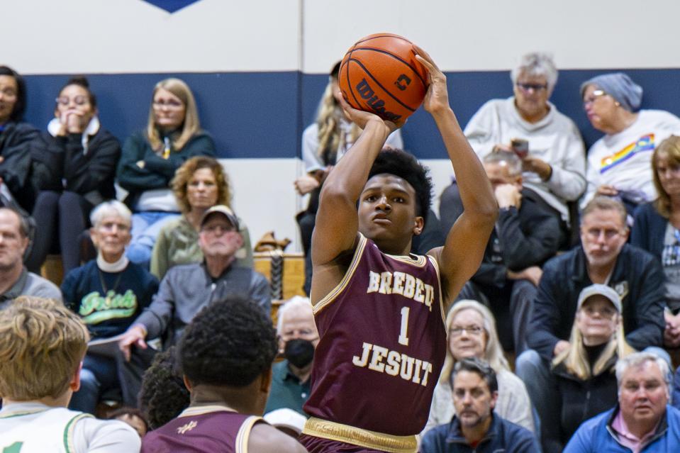 Brebeuf Jesuit Preparatory High School senior Evan Haywood (1) takes a shot during the first half of an IHSAA basketball game against Indianapolis Cathedral High School, Friday, Dec. 1, 2023, at Cathedral.