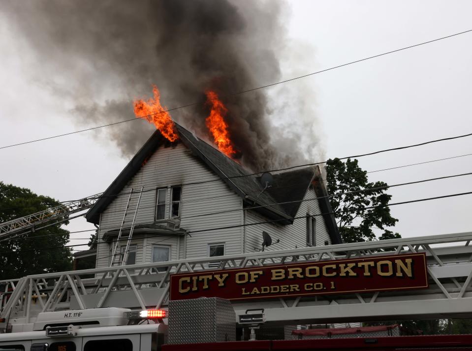 Brockton firefighters battle a three-alarm fire at 148 Florence St. at a multi-family home on Saturday, May 21, 2022.
