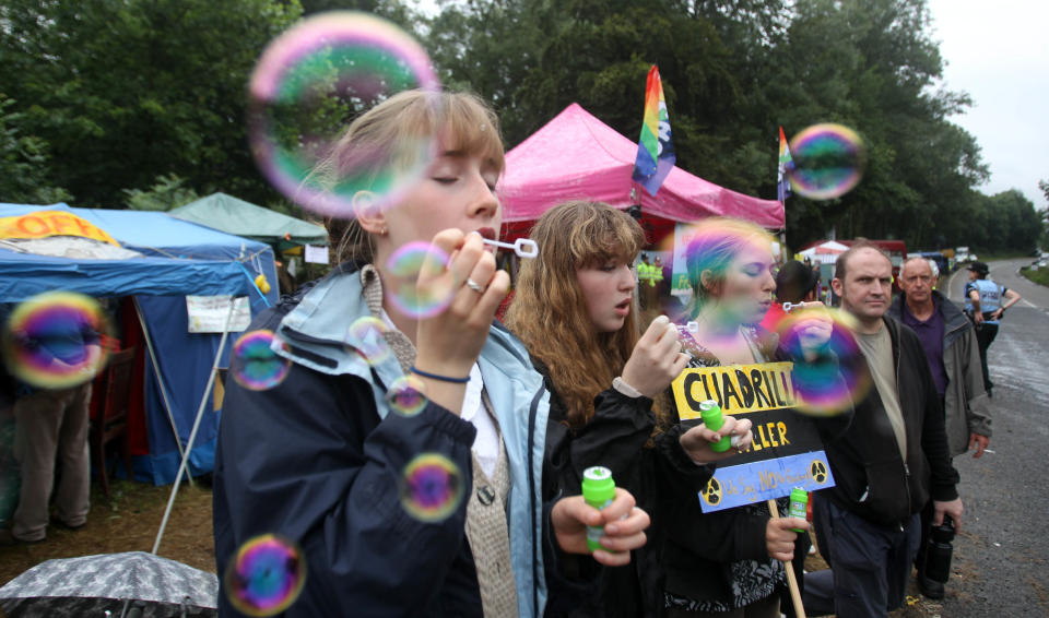 Protesters blow bubbles at the Balcombe fracking site in West Sussex as energy company Cuadrilla has started testing equipment ahead of exploratory oil drilling in the English countryside as anti-fracking protests at the site entered a ninth day.