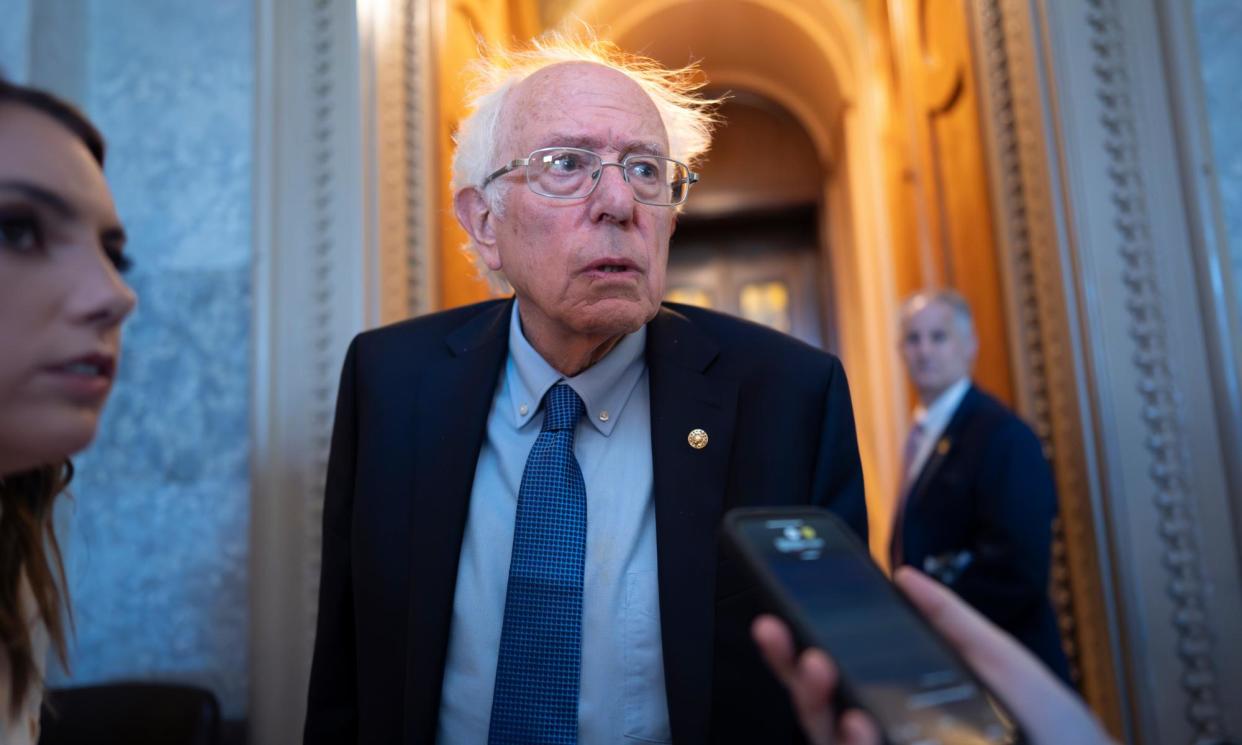 <span>Bernie Sanders speaks with reporters as the Senate prepares to advance the $95bn aid package for Ukraine, Israel and Taiwan at the Capitol, on 23 April.</span><span>Photograph: J Scott Applewhite/AP</span>