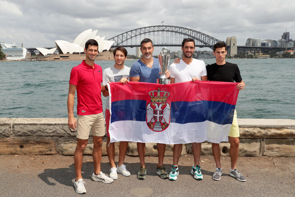 (L-R) Novak Djokovic, Dusan Lajovic, Nenad Zimonjic, Viktor Troicki and Nikola Cacic of Team Serbia pose with the ATP Cup during a media opportunity after winning the 2020 ATP Cup, at Mrs Macquarie's Chair on January 13, 2020 in Sydney, Australia.