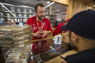 <p>A customer buys cannabis products at MedMen, one of the two Los Angeles area pot shops that began selling marijuana for recreational use under the new California marijuana law today, on Jan. 2, 2018 in West Hollywood, Calif. (Photo: David McNew/Getty Images) </p>