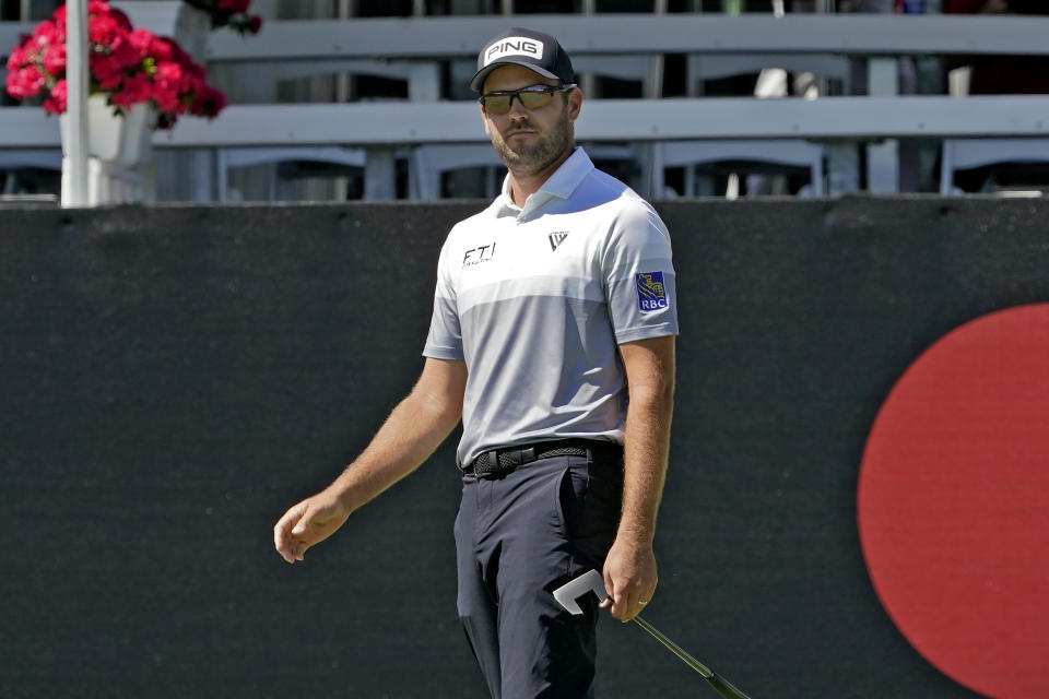 Corey Conners, of Canada, reacts as he watches his putt on the 17th hole during the second round of the Arnold Palmer Invitational golf tournament Friday, March 5, 2021, in Orlando, Fla. (AP Photo/John Raoux)