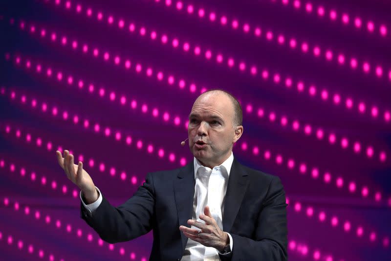FILE PHOTO: Nick Read, CEO of Vodafone, gestures as he speaks during the Mobile World Congress in Barcelona