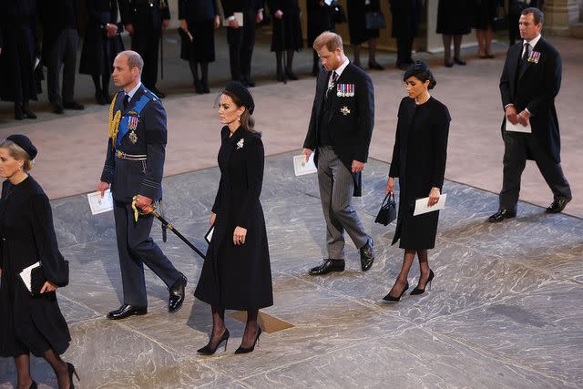 Darren Fletcher - WPA Pool/Getty Prince William, Kate Middleton, Prince Harry and Meghan Markle follow the coffin of Queen Elizabeth into Westminster Hall on September 14, 2022