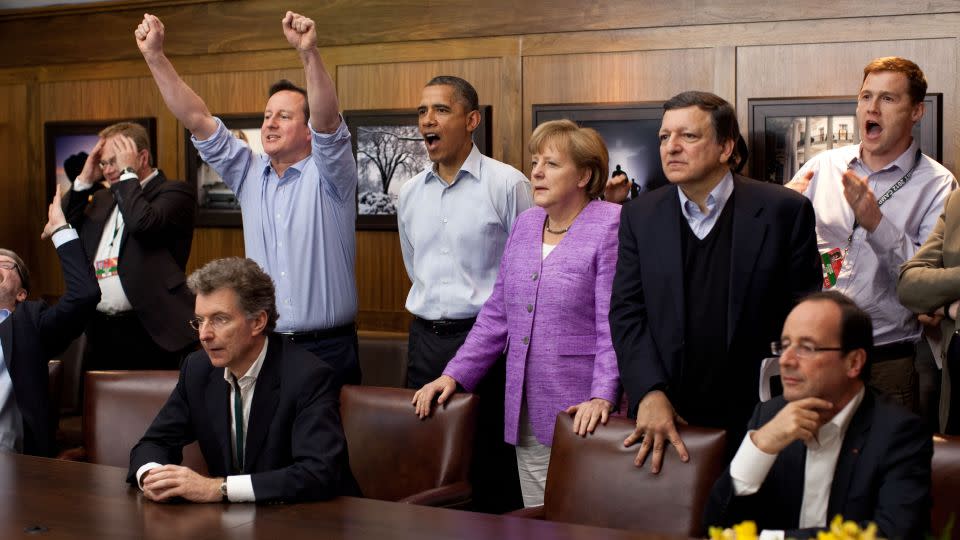 In this handout provided by The White House, Prime Minister David Cameron of the United Kingdom, U.S. President Barack Obama, Chancellor Angela Merkel of Germany, Jose Manuel Barroso, President of the European Commission, and others watch the overtime shootout of the Chelsea vs. Bayern Munich Champions League final in the Laurel Cabin conference room during the G8 Summit on May 19, 2012 at Camp David, Maryland.  - Pete Souza/The White House/Getty Images