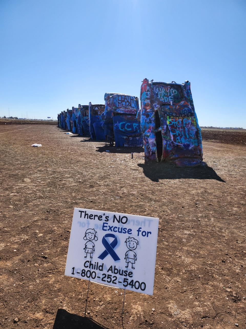 Cadillac Ranch goes blue as the Texas Department of Family Protective Services in collaboration with Saint Francis Ministries paint the local monument in honor of national Child Abuse Prevention month.