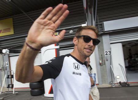 McLaren Formula One driver Jenson Button of Britain walks in the pit lane ahead of the weekend's Belgian F1 Grand Prix in Spa-Francorchamps, Belgium, August 20, 2015. REUTERS/Yves Herman