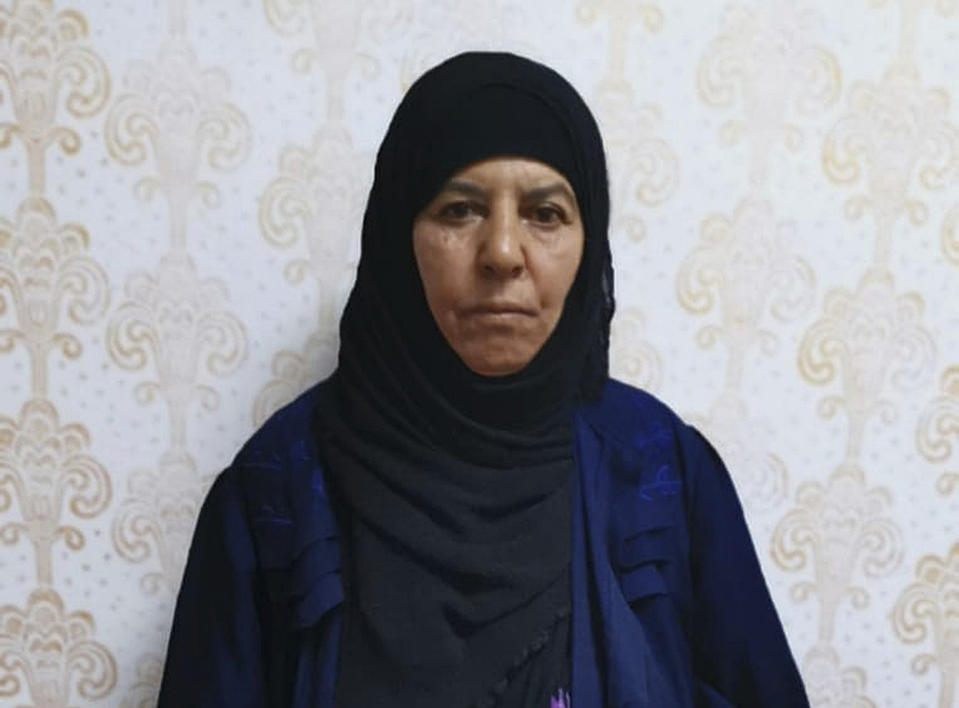 Undated handout photo made available by unnamed government sources showing a 65-year-old woman known as Rasmiya Awad, who is the sister of the slain leader of the Islamic State group Abu Bakr al-Baghdadi. Turkey captured the elder sister of the slain leader of the Islamic State group in northwestern Syria on Monday Nov. 4, 2019, according to a senior Turkish official, who called the arrest an intelligence "gold mine." Awad was captured in a raid Monday evening on a trailer container she was living in with her family near the town of Azaz in Aleppo province. (Handout via AP)