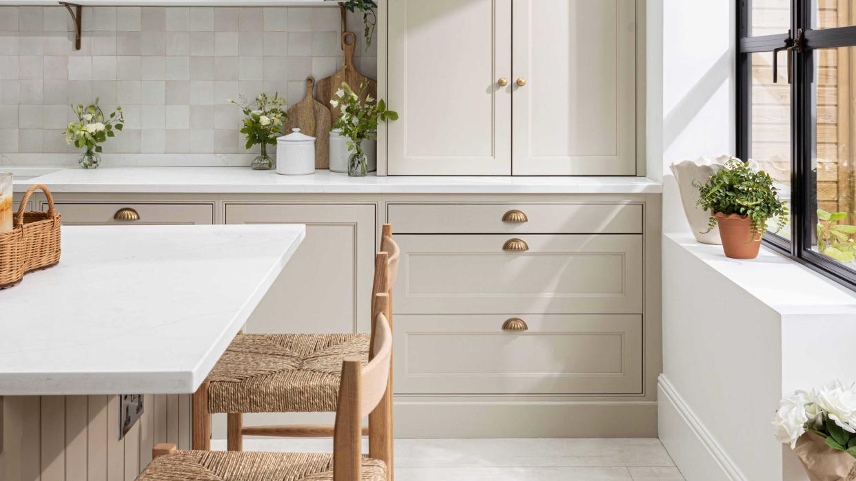  kitchen with neutral cabinetry and island 