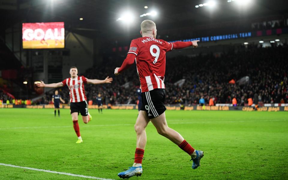 Oliver McBurnie of Sheffield United celebrates after he scores his sides first goal during the Premier League match between Sheffield United and West Ham United - Getty Images Europe