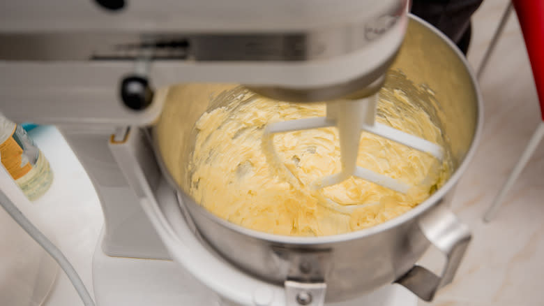 Electric mixer mixing butter