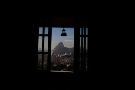 Sugar Loaf mountain is seen through a window of Favelinha (Little favela) hostel in Pereira da Silva favela, in Rio de Janeiro, Brazil, April 21, 2016. REUTERS/Pilar Olivares