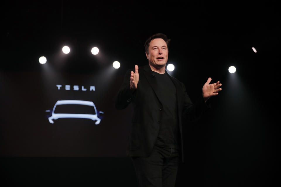 FILE- In this March 14, 2019, file photo Tesla CEO Elon Musk speaks before unveiling the Model Y at Tesla's design studio in Hawthorne, Calif. Musk appears poised to transform the company’s electric cars into driverless vehicles in a risky bid to realize a bold vision that he has been floating for years. The technology required to make that quantum leap is scheduled to be shown off to Tesla investors Monday, April 22, 2019, at the company’s Palo Alto, Calif., headquarters. (AP Photo/Jae C. Hong, File)