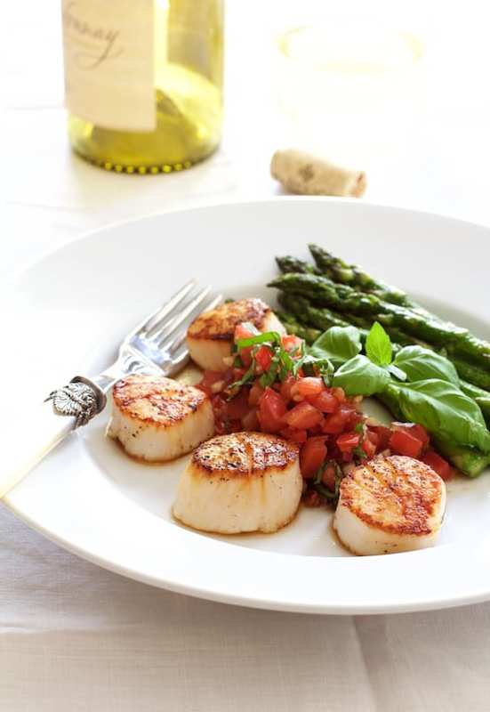 <p>From A Chef's Kitchen</p><p>Balsamic salsa is worth eating with everything, especially these perfectly browned and juicy scallops.</p><p><strong>Get the recipe: <a href="https://www.fromachefskitchen.com/seared-sea-scallops-tomato-red-onion-balsamic-salsa/" rel="nofollow noopener" target="_blank" data-ylk="slk:Seared Sea Scallops with Tomato, Red Onion and Balsamic Salsa;elm:context_link;itc:0;sec:content-canvas" class="link rapid-noclick-resp">Seared Sea Scallops with Tomato, Red Onion and Balsamic Salsa</a></strong></p>