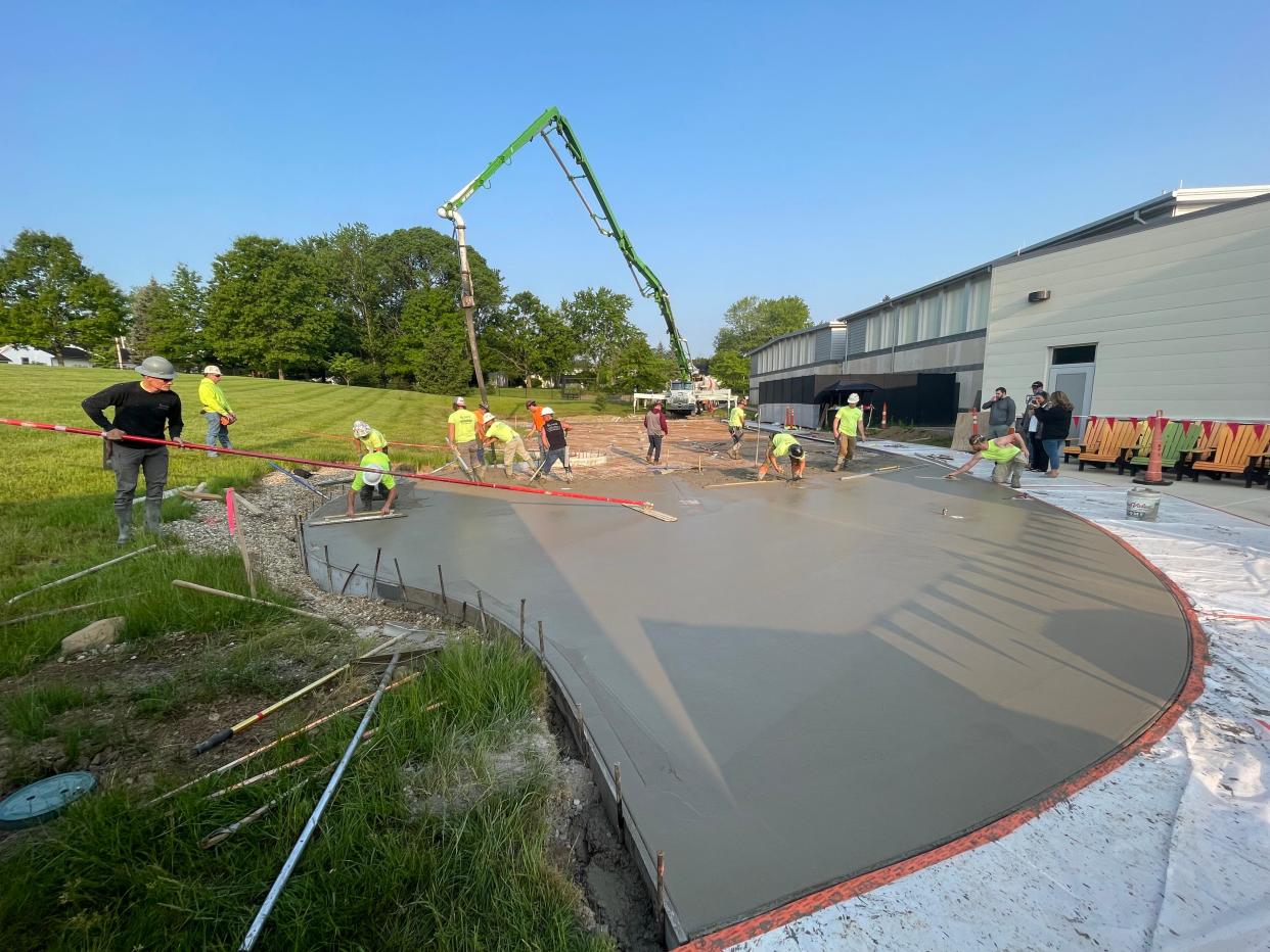 Workers from Sloan Concrete pour a slab that will be the future home of RJ's Spray Park at the Salvation Army’s Ashland Kroc Center.