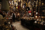 Carnival masks placed on display in a Venetian artisan mask makers workshop in Venice, Italy, Saturday, Jan. 30, 2021. Last year, with fear over the new coronavirus mounting, authorities abruptly shut down Venice Carnival on its third day, just before Italy became the first country in the West facing a outbreak. (AP Photo/Antonio Calanni)