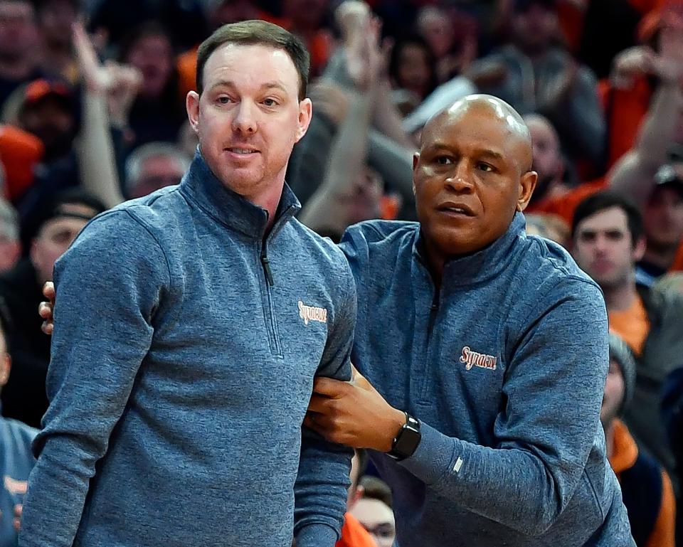 Adrian Autry, right, had his debut as head coach of the Syracuse University men's basketball team on Monday with an 83-72 win over UNH.