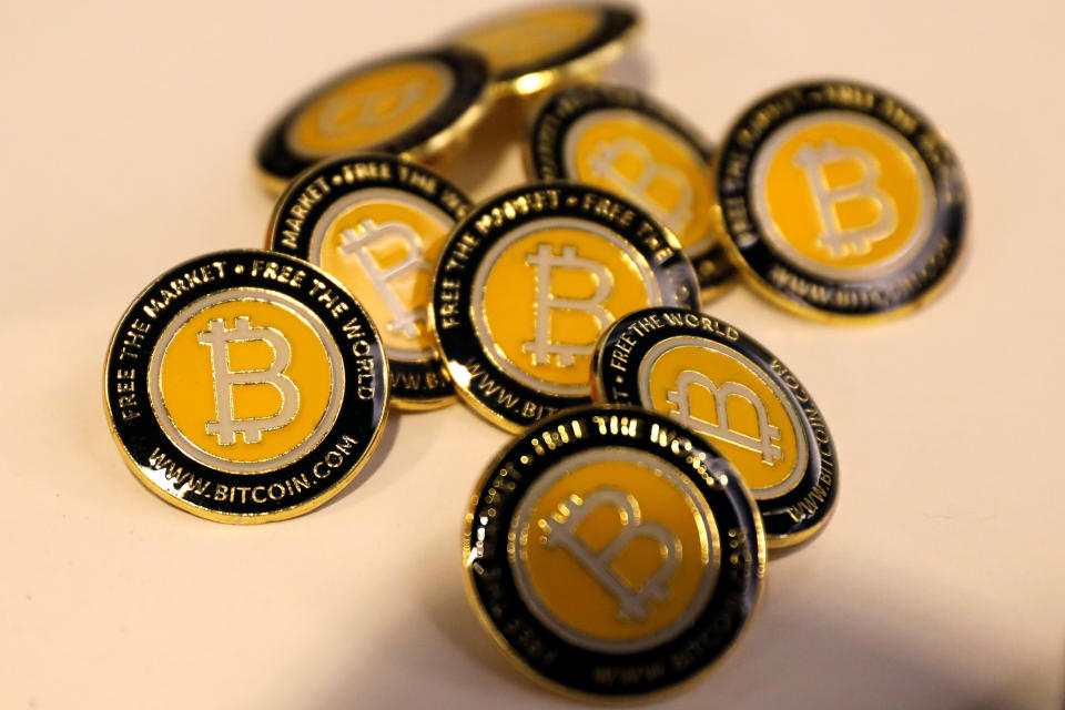 Bitcoin.com buttons are seen displayed on the floor of the Consensus 2018 blockchain technology conference in New York City, New York, U.S., May 16, 2018. REUTERS/Mike Segar