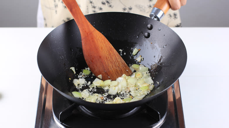onion and garlic sauteed in wok