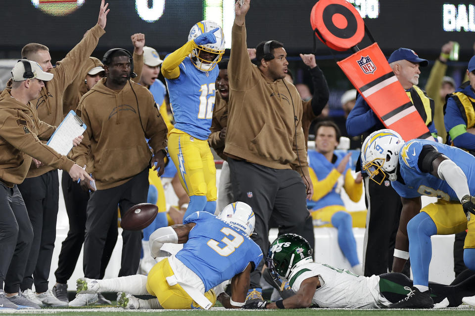 Los Angeles Chargers safety Derwin James Jr. (3) slides out of bounds after recovering a fumble by New York Jets wide receiver Garrett Wilson (17) during the first quarter of an NFL football game, Monday, Nov. 6, 2023, in East Rutherford, N.J. (AP Photo/Adam Hunger)