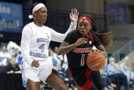 North Carolina guard Kennady Tucker (4) guards against Louisville guard Dana Evans (1) during the first half of an NCAA college basketball game in Chapel Hill, N.C., Sunday, Jan. 19, 2020. (AP Photo/Gerry Broome)