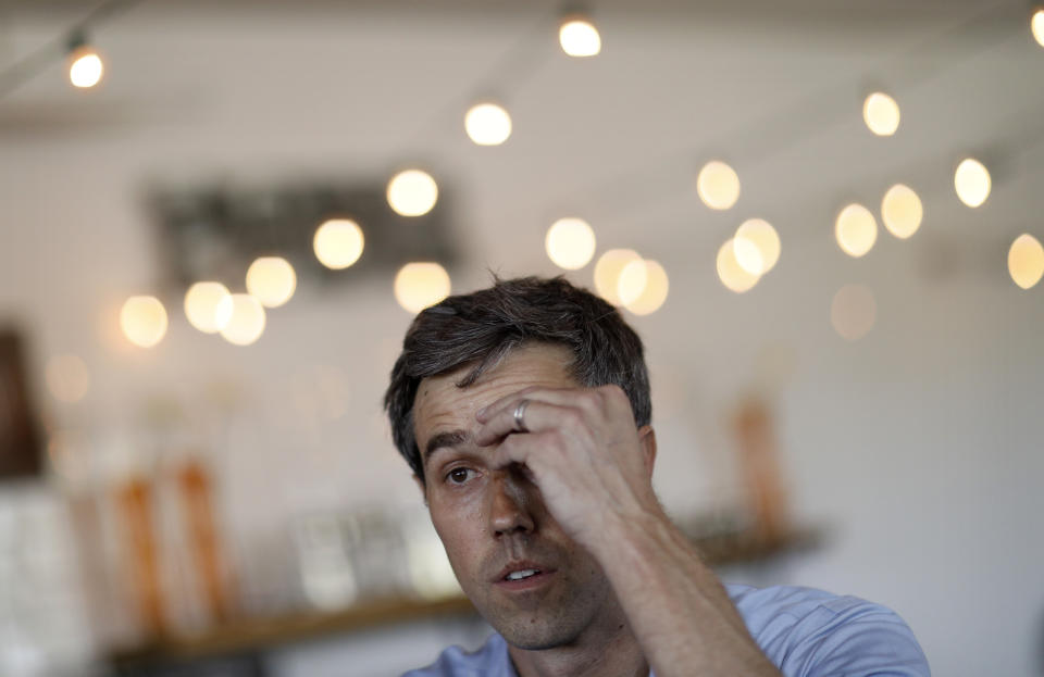 Democratic presidential candidate and former Texas congressman Beto O'Rourke wipes sweat from his brow as he speaks at a campaign stop at a coffee shop Sunday, March 24, 2019, in Las Vegas. (AP Photo/John Locher)