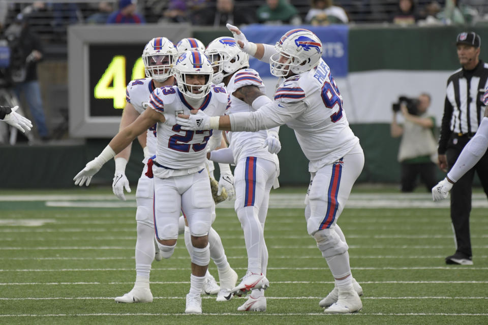 Buffalo Bills' Micah Hyde (23), left, celebrates his interception during the first half of an NFL football game against the New York Jets, Sunday, Nov. 14, 2021, in East Rutherford, N.J. (AP Photo/Bill Kostroun)