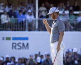 Talor Gooch pumps his fist after sinking his par putt on the 18th hole during the final round of the RSM Classic golf tournament, Sunday, Nov. 21, 2021, in St. Simons Island, Ga. (AP Photo/Stephen B. Morton)