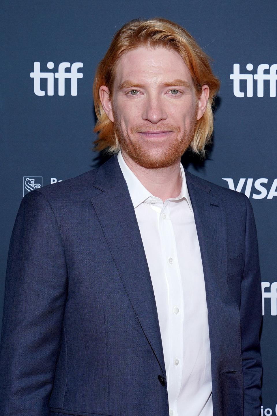 Domhnall Gleeson in a suit on the red carpet at the Toronto International Film Festival (TIFF)