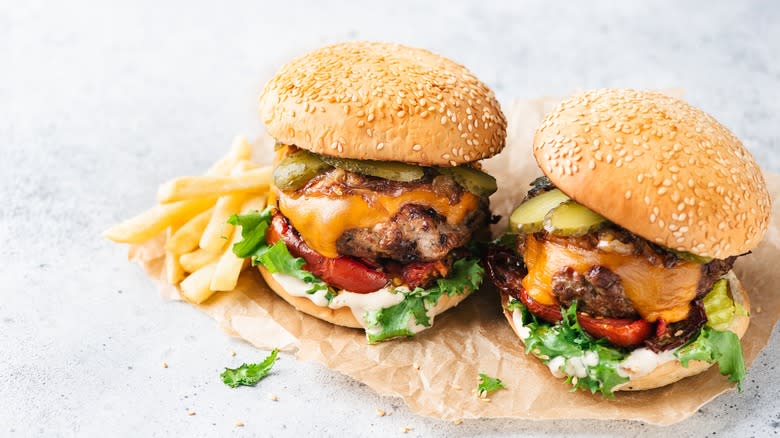 Burgers with veggies on plate