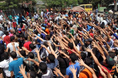 Protesters, supporters of the Muslim Brotherhood, shout slogans in the Matariya area in Cairo, August 14, 2014. REUTERS/Al Youm Al Saabi Newspaper