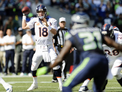 Peyton Manning got hot late against Seattle before falling in overtime. (USA TODAY Sports) 