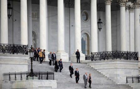 FILE PHOTO: Newly elected members of Congress walk down the steps of the Capitol as they arrive for a class photo for incoming freshman members of the U.S. House of Representatives on Capitol Hill in Washington, U.S., November 14, 2018. REUTERS/Carlos Barria/File Photo