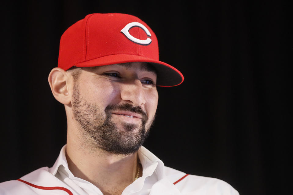 Cincinnati Reds' Nick Castellanos wears his cap during a news conference, Tuesday, Jan. 28, 2020, in Cincinnati. Castellanos signed a $64 million, four-year deal with the baseball club. (AP Photo/John Minchillo)