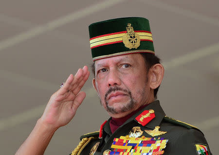 Brunei's Sultan Hassanal Bolkiah salutes during the 34th National Day celebrations in Bandar Seri Begawan, Brunei February 24, 2018. Picture taken February 24, 2018. REUTERS/Ahim Rani