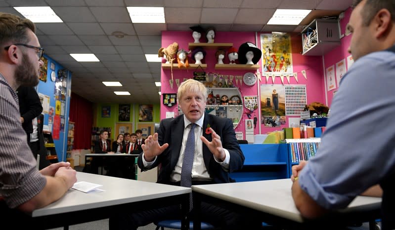 FILE PHOTO: Britain's Prime Minister Boris Johnson visits George Spencer Academy during a general election campaign, in Stapleford