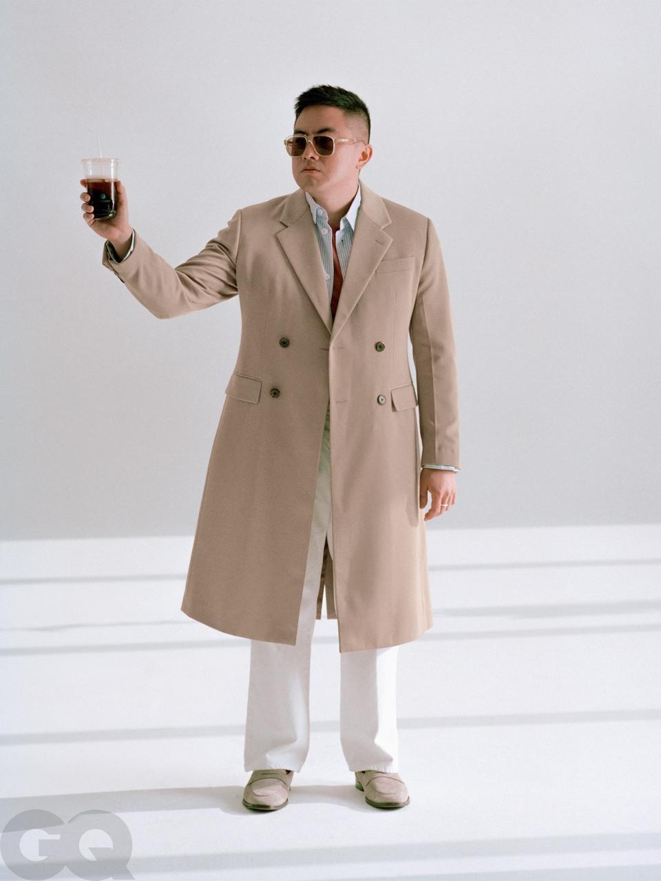 <cite class="credit">Coat, $3,970, jacket, $1,560, and pants, $840, by Prada / T-shirt, $65, by Hanro / Shoes, $375, by Bruno Magli / Sunglasses, $375, by Bottega Veneta</cite>