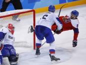 Ice Hockey – Pyeongchang 2018 Winter Olympics – Men Preliminary Round Match – Czech Republic v South Korea - Gangneung Hockey Centre, Gangneung, South Korea – February 15, 2018 - Michal Vondrka of the Czech Republic is knocked off his skates by Bryan William Young of South Korea during the third period. REUTERS/Brian Snyder