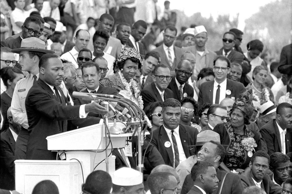 The Rev. Dr. Martin Luther King Jr., head of the Southern Christian Leadership Conference, speaks to thousands during his "I Have a Dream" speech in front of the Lincoln Memorial for the March on Washington for Jobs and Freedom in Washington on Aug. 28, 1963. Actor-singer Sammy Davis Jr. is at bottom right. 