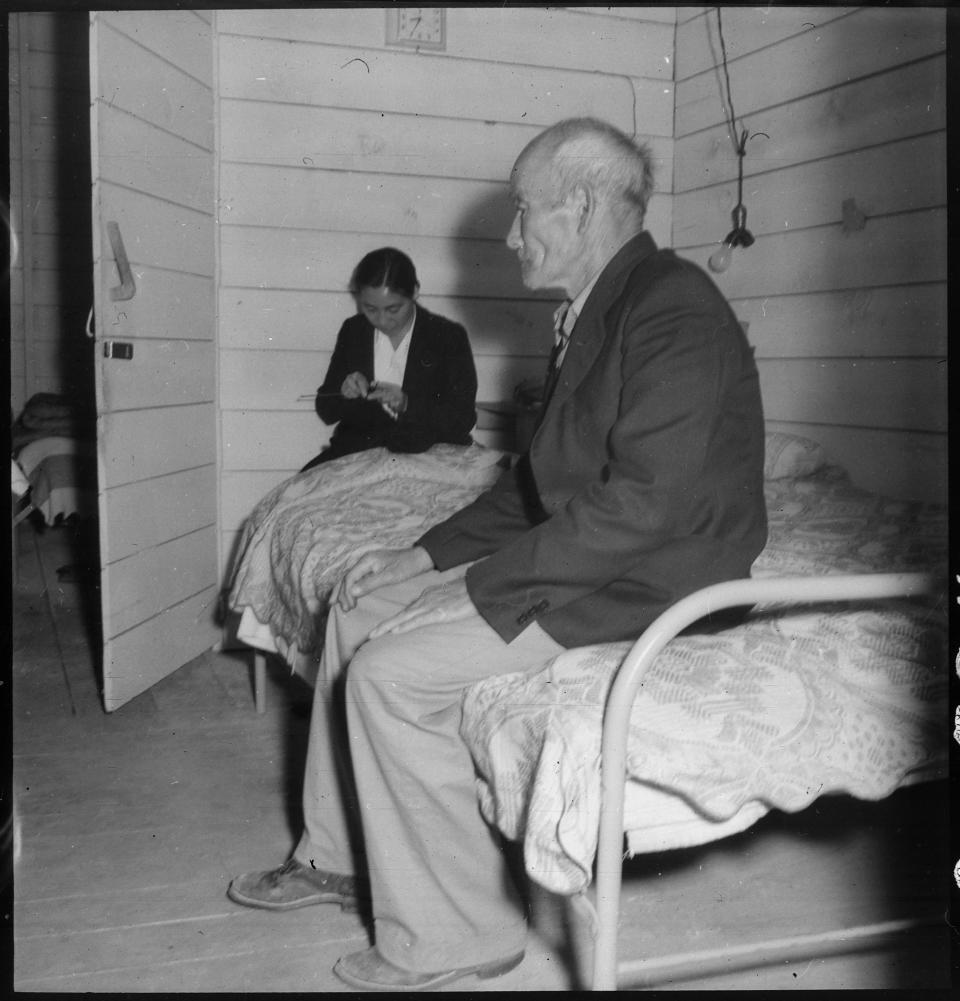 Old Mr. Konda in barrack apartment, after supper