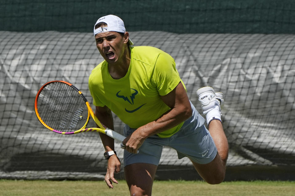 Spain's Rafael Nadal serves as he practices ahead of the Wimbledon tennis championships in London, Sunday, June 26, 2022. (AP Photo/Alastair Grant)