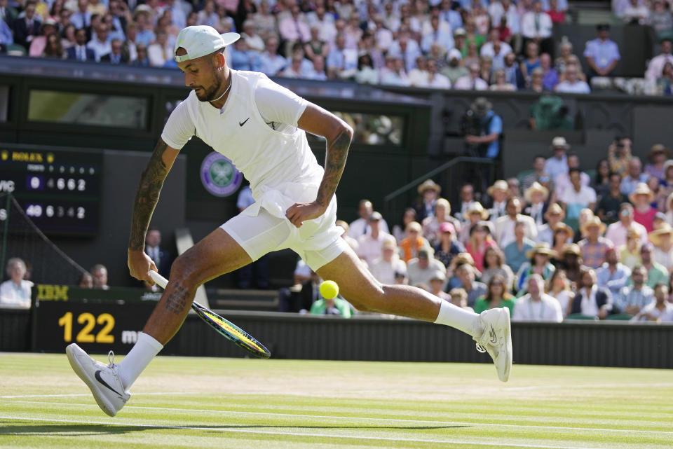 FILE - Australia's Nick Kyrgios returns the ball from between his legs to Serbia's Novak Djokovic in the final of the men's singles on Day 14 of the Wimbledon tennis championships in London, Sunday, July 10, 2022. (AP Photo/Alastair Grant, File)