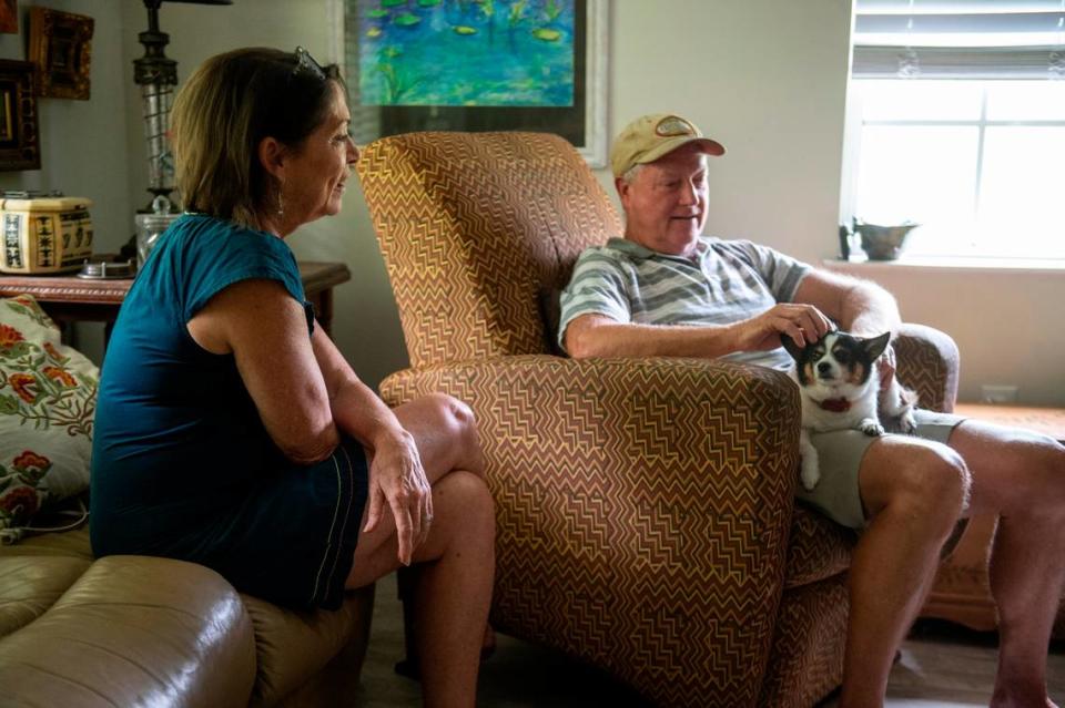 Tami Curtis Guy, her husband Perry Guy, and their dog Tippi at their home in Bay St. Louis on Monday, April 29, 2024. The Guys have been fighting to receive a FEMA grant that will cover most of the cost to elevate their home, which has flooded twice.
