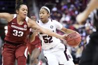 South Carolina guard Tyasha Harris (52) dribbles against Arkansas guard Chelsea Dungee (33) during the second half of an NCAA college basketball game Thursday, Jan. 9, 2020, in Columbia, S.C. (AP Photo/Sean Rayford)