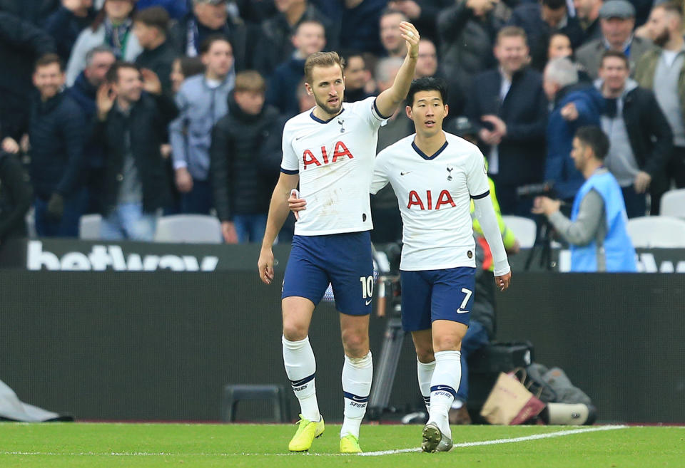 LONDON, ENGLAND - NOVEMBER 23: Harry Kane of Tottenham Hotspur celebrates with Heung-Min Son of Tottenham Hotspur after scoring his team's third goal  during the Premier League match between West Ham United and Tottenham Hotspur at London Stadium on November 23, 2019 in London, United Kingdom. (Photo by Stephen Pond/Getty Images)