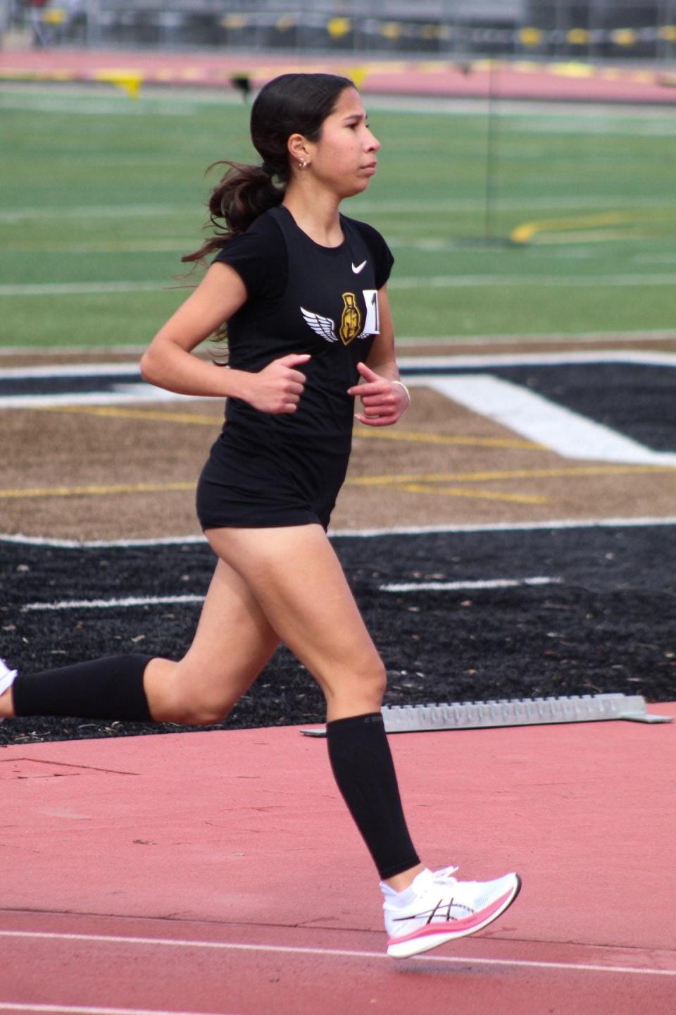 Lathrop's Jacqueline Pena Santillan runs during one of the Spartans' track meets during the 2023-24 season.