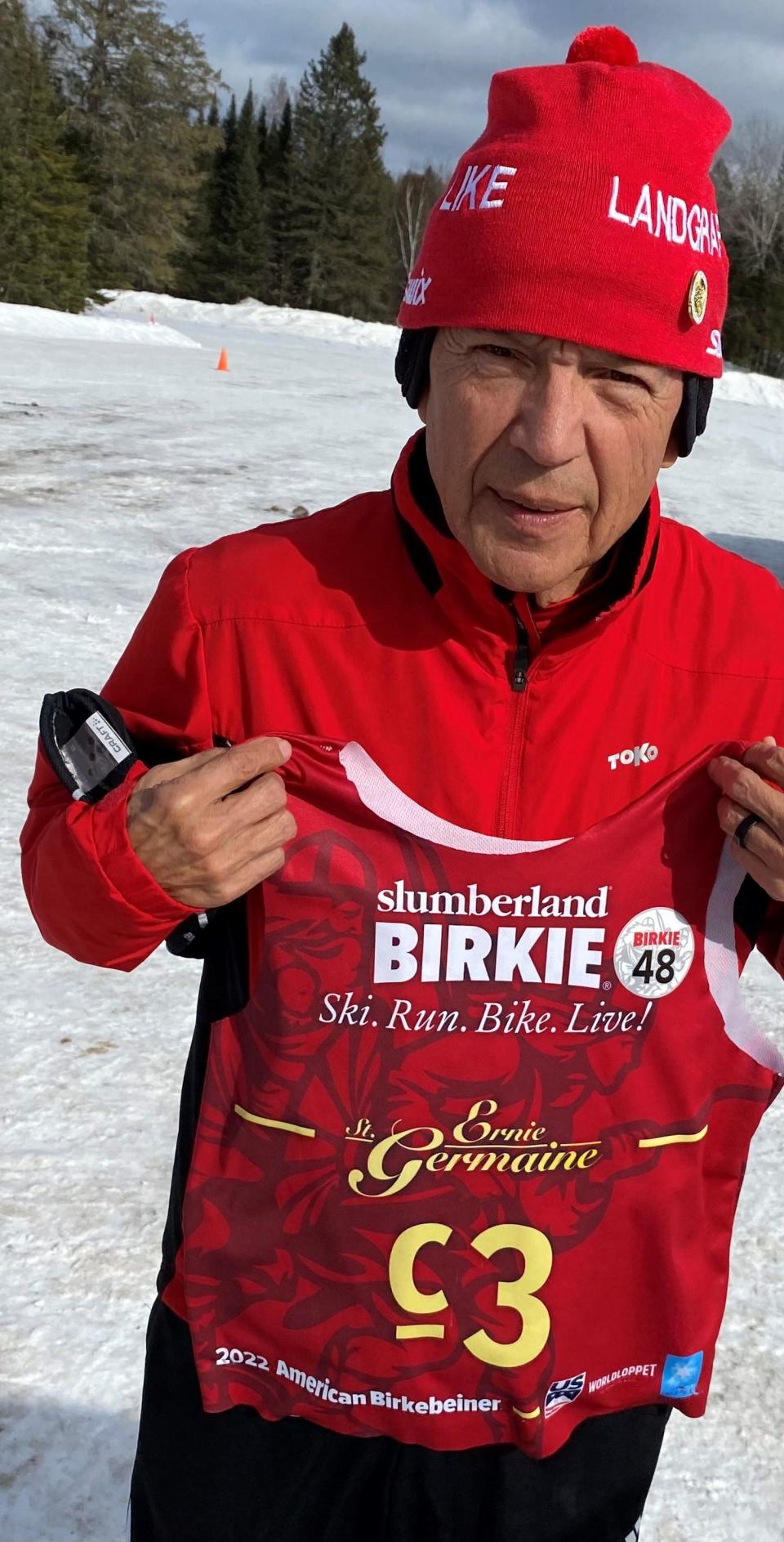 Before the 2022 race, Ernie St. Germaine displays his one-of-a-kind racing bib, designed for him as the only person to have skied every Birkie race since 1973.
