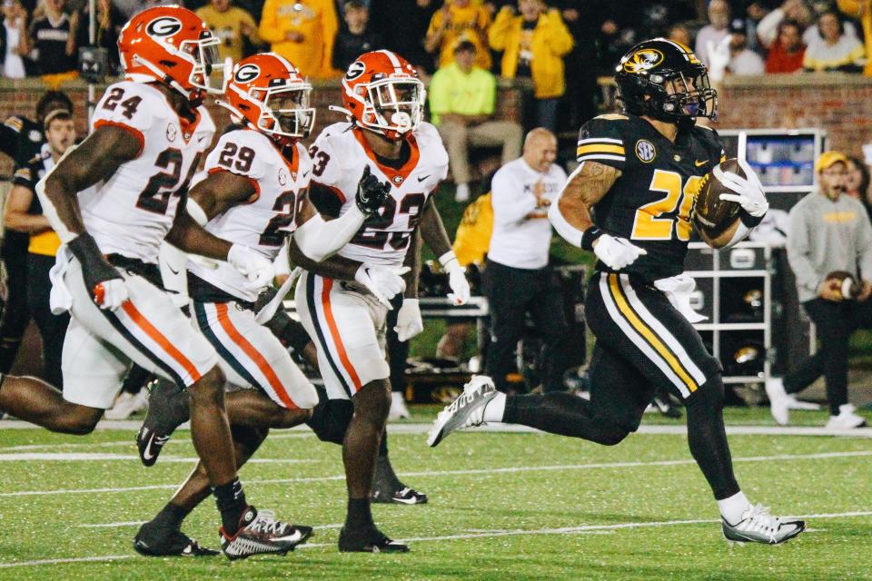 Missouri running Cody Schrader (20) runs away from the Georgia defense on a 63-yard run during the Tigers' game against No. 1 Georgia on Oct. 1, 2022, at Faurot Field.