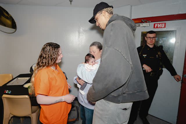 <p>Michael Cummings</p> Kyle Kuzma visits a female inmate in Flint, Michigan